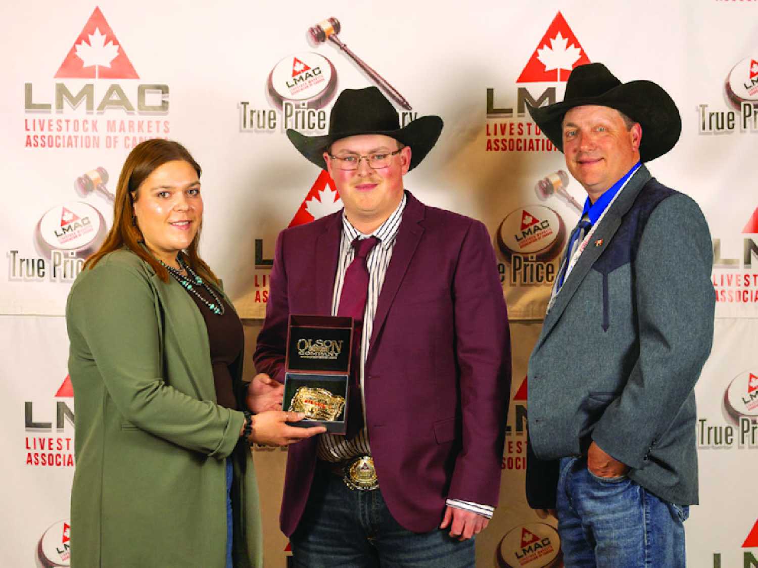Man/Sask Champion Auctioneer Ty Culter receives his award presented by Boehringer Ingelheim rep Bria Bently and LMAC President Allan Munroe.